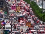 Vehicles lined up in a heavy traffic jam on the Delhi-Gurugram Expressway following torrential rainfall, in Gurugram.
