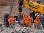 National Disaster Response Force (NDRF) teams remove debris while searching for signs of life in the basement during morning search and rescue operations at the site of a collapsed building in Satya Niketan, New Delhi, India, on Monday, September 7, 2026. 