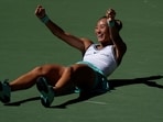 China's Qinwen Zheng celebrates after winning her round of 16 match against Poland's Iga Swiatek