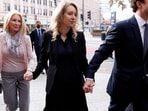 Theranos founder Elizabeth Holmes arrives with her family to be sentenced on her convictions for defrauding investors in the blood testing startup at the federal courthouse in San Jose, California, U.S., November 18, 2022.