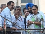 Municipal Corporation of Delhi (MCD) Commissioner Sanjeev Khirwar (2nd from left) at the site of a collapsed building in Satya Niketan, on Monday(Vipin Kumar/Hindustan Times)