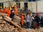 NDRF and fire department officials conduct a rescue operation at Satya Niketan near Delhi University on Sunday.