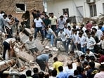 Even when cranes arrived to move bigger chunks of the rubble, the locals and students continued removing the smaller parts to help the rescue mission. (Sanchit Khanna/HT Photo)