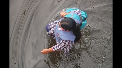 A schoolgirl wades through a waterlogged street on her way to school in Varanasi on Monday. (Rajesh Kumar/ HT photo) A schoolgirl wades through a waterlogged street on her way to school in Varanasi on Monday. (Rajesh Kumar/ HT photo)