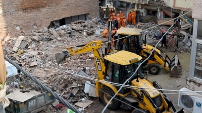 JCB machines remove debris during rescue operations at the site of a building collapse near Satya Niketan in South-West Delhi, in New Delhi on Monday. (ANI) JCB machines remove debris during rescue operations at the site of a building collapse near Satya Niketan in South-West Delhi, in New Delhi on Monday. (ANI)