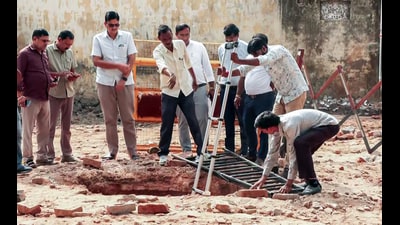Archaeological Survey of India (ASI) officials inspect the structural openings of an ancient brick-lined well that was discovered (6th Sep) during the demolition drive of a mosque at the Collectorate complex, in Saharanpur on Monday. (ANI Video Grab)