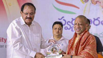CM Yogi Adityanath with former Vice President M Venkaiah Naidu during the Silver Jubilee programme of the ‘Swarna Bharat Trust’ in Nellore, Andhra Pradesh, on Monday. (PTI PHOTO)