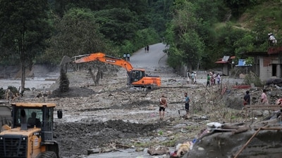 An excavator repairs a damaged road near the Trishuli River, following deadly flash floods and a mudslide, in Jiling, Bagmati Province, Nepal, September 7, 2026. (REUTERS)
