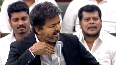 Amid a tense scene in the state assembly, CM Vijay extended his hand to help Chandrasekhar get up. This gesture drew reactions from members present. (PTI) Amid a tense scene in the state assembly, CM Vijay extended his hand to help Chandrasekhar get up. This gesture drew reactions from members present. (PTI)