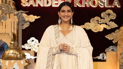 Sonam Kapoor has donned a translucent cream sari with gold floral motifs and an intricate border at the Abu Jani and Sandeep Khosla show. (abujanisandeepkhosla/Instagram) Sonam Kapoor has donned a translucent cream sari with gold floral motifs and an intricate border at the Abu Jani and Sandeep Khosla show. (abujanisandeepkhosla/Instagram)