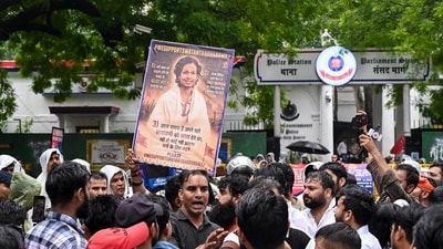 Supporters of Hindutva influencer Swatantra Bhardwaj stage a protest outside Parliament Street police station on Saturday. (PTI)