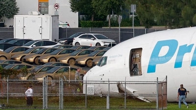 Tesla Cybercabs parked near Miami airport before the Amazon plane crash. (REUTERS/Marco Bello) (REUTERS)