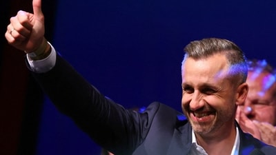 Top candidate of the far-right Alternative for Germany (AfD), Ulrich Siegmund, gives a thumbs up during the AfD election party. (REUTERS)