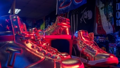 Merchandise at Trump Town USA includes Trump-themed sneakers. Merchandise at Trump Town USA includes Trump-themed sneakers.