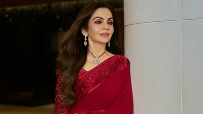 Nita Ambani stunned in deep-crimson red saree paired with matching full-sleeved blouse at the Sandeep Khosla's show. (mickeycontractor/Instagram) Nita Ambani stunned in deep-crimson red saree paired with matching full-sleeved blouse at the Sandeep Khosla's show. (mickeycontractor/Instagram)