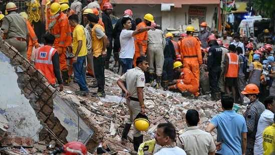 Rescue personnel conduct a search operation in the Satya Niketan area in New Delhi. (AFP)