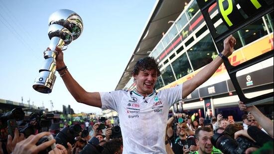 Mercedes' Andrea Kimi Antonelli celebrates with fans and the trophy after winning the Italian GP. (REUTERS)