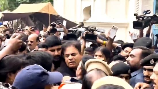 Bharat Rashtra Samithi (BRS) Working President KT Rama Rao scuffles with police personnel as he is detained along with party leaders during a protest outside the Telangana Assembly