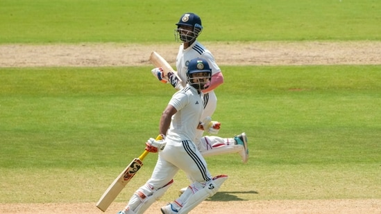 East Zone's captain Ishan Kishan, front, and Anukul Roy run between the wickets on day 2 of the Duleep Trophy 2026-27 final cricket match between South Zone and East Zone