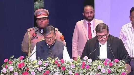 Punjab governor Gulab Chand Kataria administering the oath to justice Ashwani Kumar Mishra as the chief justice of the Punjab and Haryana high court in Chandigarh on Monday. (HT Photo)