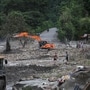 An excavator repairs a damaged road near the Trishuli River, following deadly flash floods and a mudslide, in Jiling, Bagmati Province, Nepal, September 7, 2026.