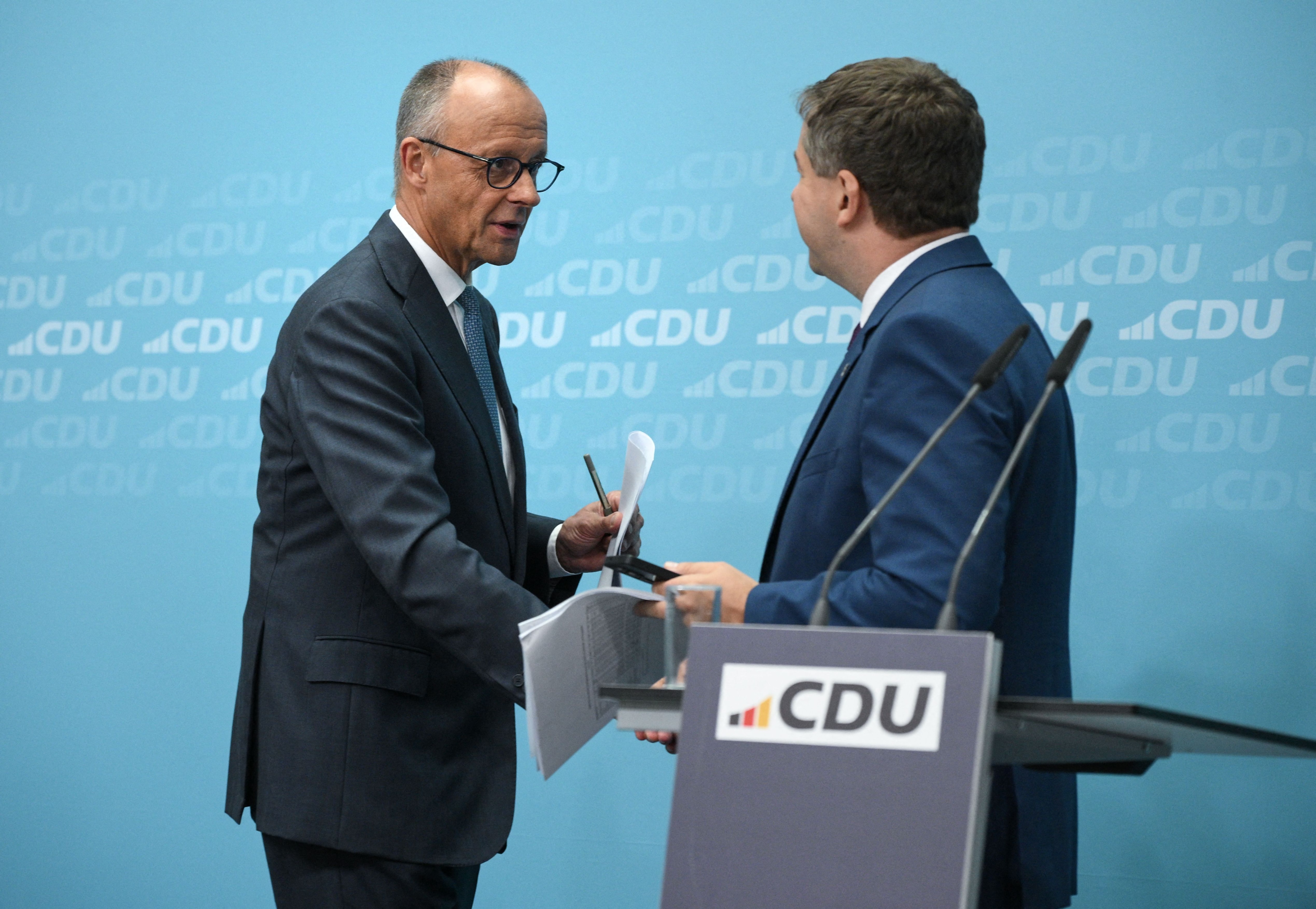 German Chancellor and leader of Germany's Christian Democratic Union (CDU) Friedrich Merz (L) and Saxony-Anhalt's State Premier Sven Schulze shake hands after a press conference following the party's leadership meeting in Berlin on September 7, 2026, one day after regional elections in the eastern federal state of Saxony-Anhalt. (AFP) German Chancellor and leader of Germany's Christian Democratic Union (CDU) Friedrich Merz (L) and Saxony-Anhalt's State Premier Sven Schulze shake hands after a press conference following the party's leadership meeting in Berlin on September 7, 2026, one day after regional elections in the eastern federal state of Saxony-Anhalt. (AFP)