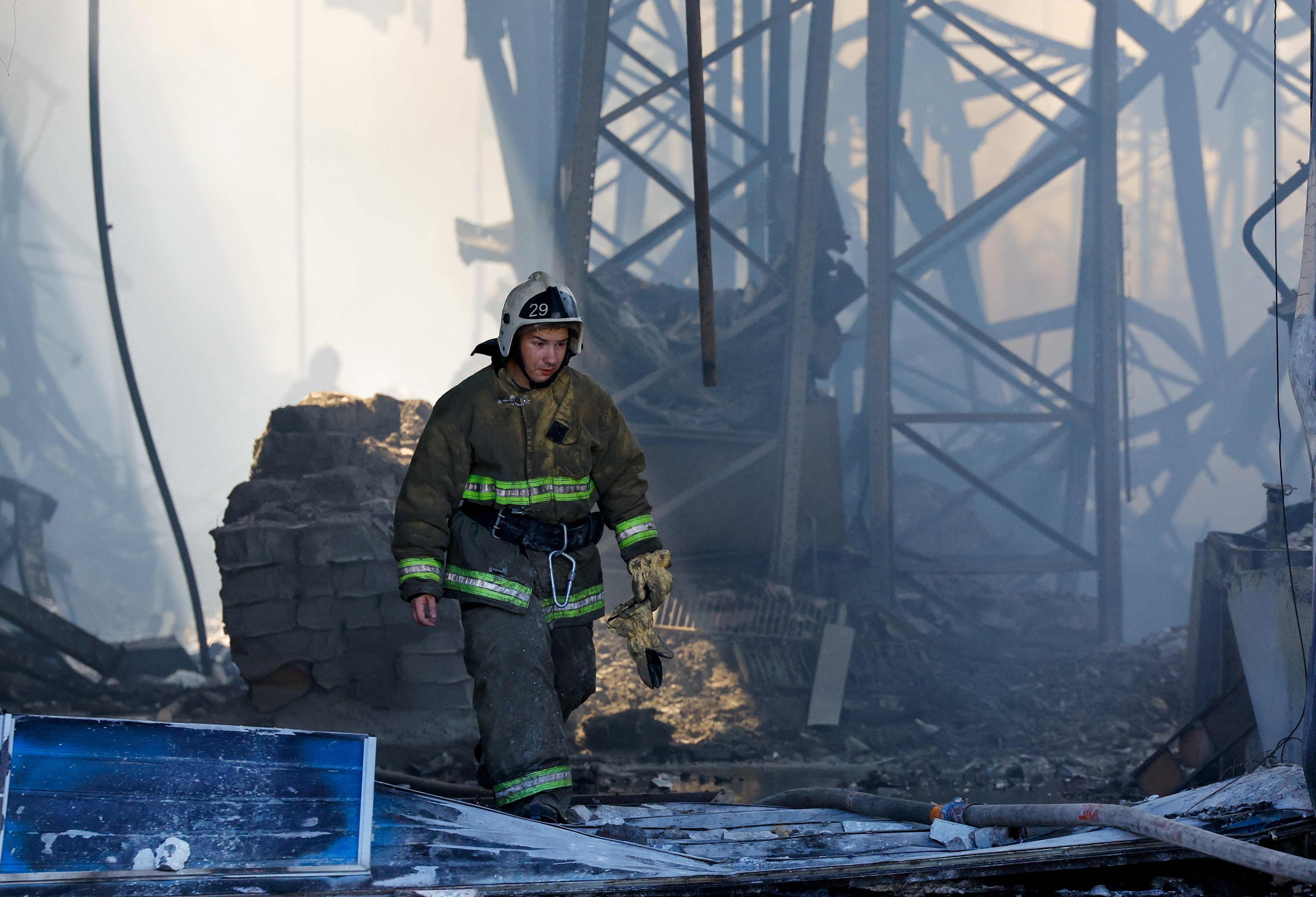 A firefighter walks out of the burnt-out shopping mall Galaktika (Galaxy) following an overnight attack, what Russian-installed authorities called a Ukrainian drone strike, in the course of the Russia-Ukraine conflict in Mariupol in the Donetsk region, a Russian-controlled area of Ukraine, September 7, 2026. (REUTERS)
