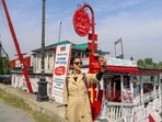 A tourist takes a selfie near the Floating Post Office on the banks of Dal Lake in Srinagar. (Waseem Andrabi/HT)