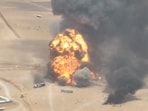 Trucks explode as they burn, during what the Houthis say was an attack targeting trucks coming from Saudi territory, at Al-Wadiah border crossing near Al-Wadiah, on the Saudi-Yemen border.