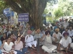 Punjab government employees observing a strike in Ludhiana on Tuesday. The protesters were demanding the immediate release of pending dearness allowance arrears. (Gurpreet Singh/HT)