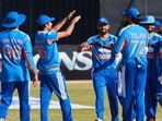 TOPSHOT - Indian players celebrate the wicket of Brian Bennet during the second Twenty20 international cricket match between Zimbabwe and India at Harare Sports Club in Harare, on July 25, 2026. (Photo by Jekesai NJIKIZANA / AFP) (AFP)