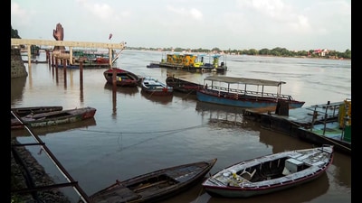 A view of the boats on the swollen Ganga River in the Namo Ghat area, triggered by heavy rainfall, in Varanasi on Tuesday. (ANI Video Grab)