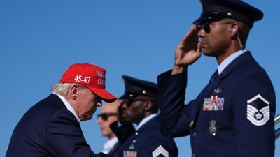 President Donald Trump sparked a row with videos alleging he didn't salute a Marine guarding the helicopter. (AP Photo)