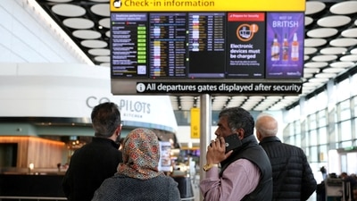 Travellers check on a departure board displaying cancelled flights at Heathrow Airport Terminal 4, in Greater London, Britain. (REUTERS/File Photo)