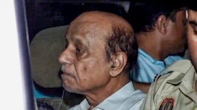 Hariram Gupta, owner of the Satya Niketan building that collapsed on Sunday and claimed the lives of seven people, being taken to South Campus police station. (PTI) Hariram Gupta, owner of the Satya Niketan building that collapsed on Sunday and claimed the lives of seven people, being taken to South Campus police station. (PTI)