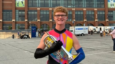 Derek Phillips, mellophone section leader of the Hawkeye Marching Band, died days after collapsing in extreme heat at a football game. Derek Phillips, mellophone section leader of the Hawkeye Marching Band, died days after collapsing in extreme heat at a football game.