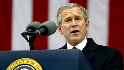 President George W. Bush speaks at Arlington National Cemetery in Virginia, Nov. 11, 2003.