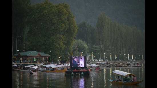 A movie is being screened on a floating cinema at the Dal Lake during the first International Film Festival in Srinagar. (Waseem Andrabi/HT)