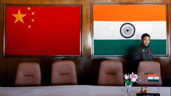 FILE PHOTO: A man walks inside a conference room used for meetings between military commanders of China and India, at the Indian side of the India-China border (REUTERS)
