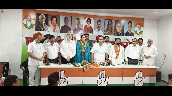 From left: Punjabi movie actress Aditi Arya, Congress Committee president HS Lucky and councillor Ram Chander Yadav during the induction ceremony in Chandigarh on Tuesday. (HT Photo)