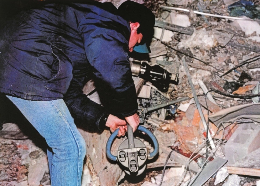 A DSS Agent operates an explosives detector inside a crater left by the 1993 World Trade Center bombing (US Bureau of Alcohol, Tobacco, and Firearms.)