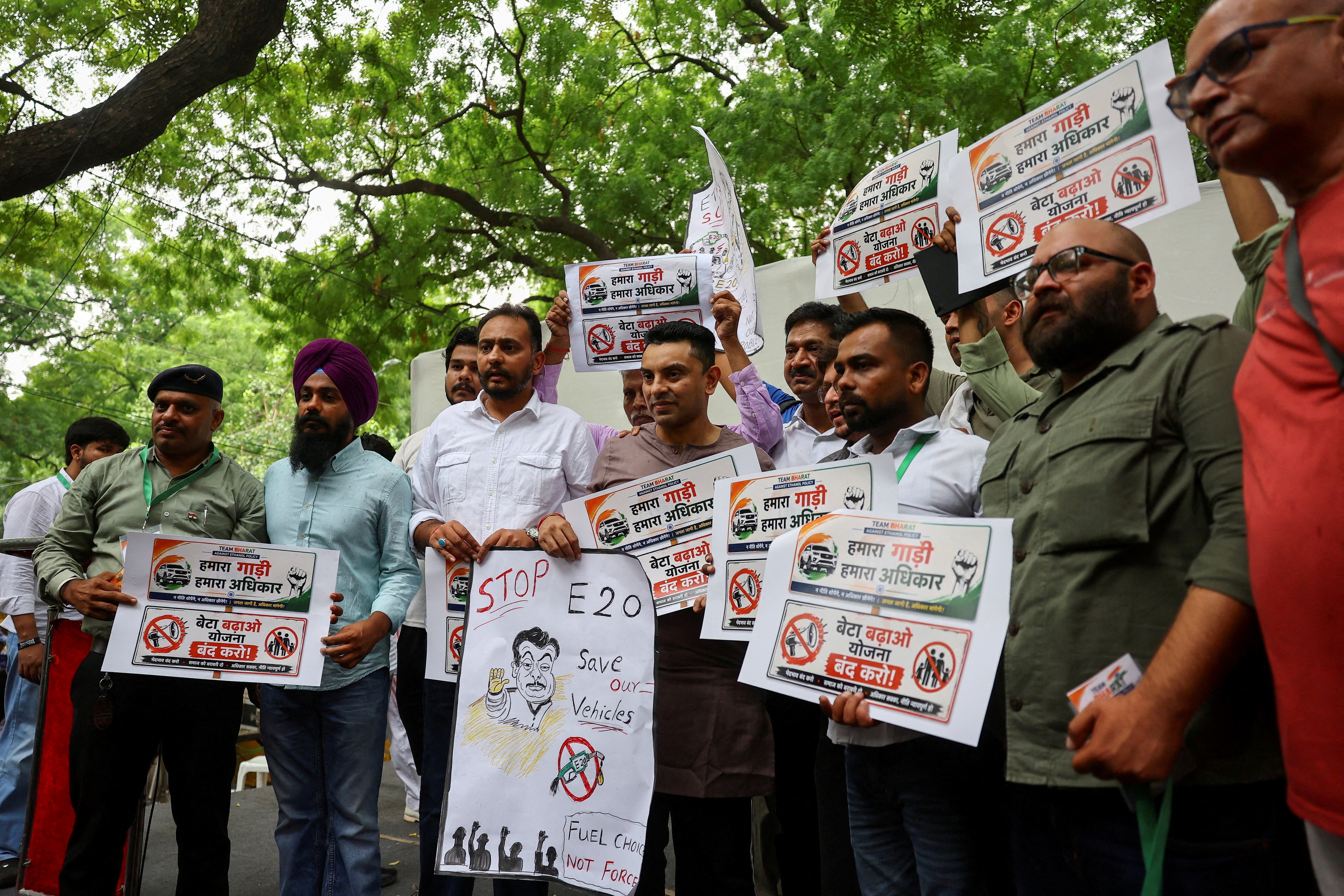 Tehseen Poonawalla, a New Delhi-based socialite and supporter of India's Congress party, holds a poster as he and others take part in a protest against the rollout of the E20 ethanol fuel-blending policy at Jantar Mantar in New Delhi, July 5, 2026. (REUTERS)