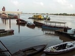 A view of the boats on the swollen Ganga River in the Namo Ghat area, triggered by heavy rainfall, in Varanasi on Tuesday. (ANI Video Grab)