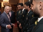 Britain's King Charles III speaks with members of the Pakistan National Cricket Team.(AFP)