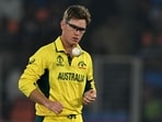 Australia's Adam Zampa tosses the ball