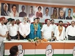 From left: Punjabi movie actress Aditi Arya, Congress Committee president HS Lucky and councillor Ram Chander Yadav during the induction ceremony in Chandigarh on Tuesday. (HT Photo)