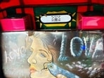 Paintings and photos are often found illustrated on the passenger seats of Delhi’s auto rickshaws. (HT Photo)