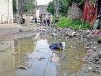Roads in deplorable condition with garbage and encroachments near Pratap Chowk in Ludhiana on Tuesday. (Gurpreet singh/ht)