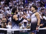 USA's Ben Shelton (R) shakes hands with Spain's Carlos Alcaraz after winning the men's singles quarter-final tennis match on day ten of the US Open