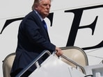 President Donald Trump is seen boarding the Qatar-gifted Air Force One after an emergency inflatable slide deployed before he arrived at Joint Base Andrews.(AP Photo/Jacquelyn Martin)
